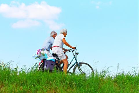 ElderlyCoupleCyclingBike
