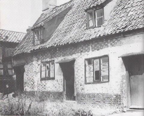 Two of the former almshouses in Dove Street, which stood next to the Workhouse and were demolished during the 1960s. Jack Rose Collection.