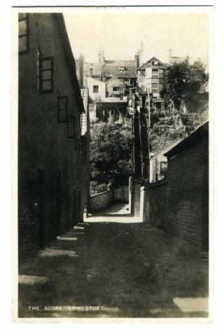 shows an access track off Whapload Road (immediately to the south of the Rectory House - which is named as such) leading up to the back of what must therefore be Nos. 14 & 15 High Street. Lowestoft Directory (1892) names the occupants of the two houses as Mrs. Hubert and Mrs. Mills.